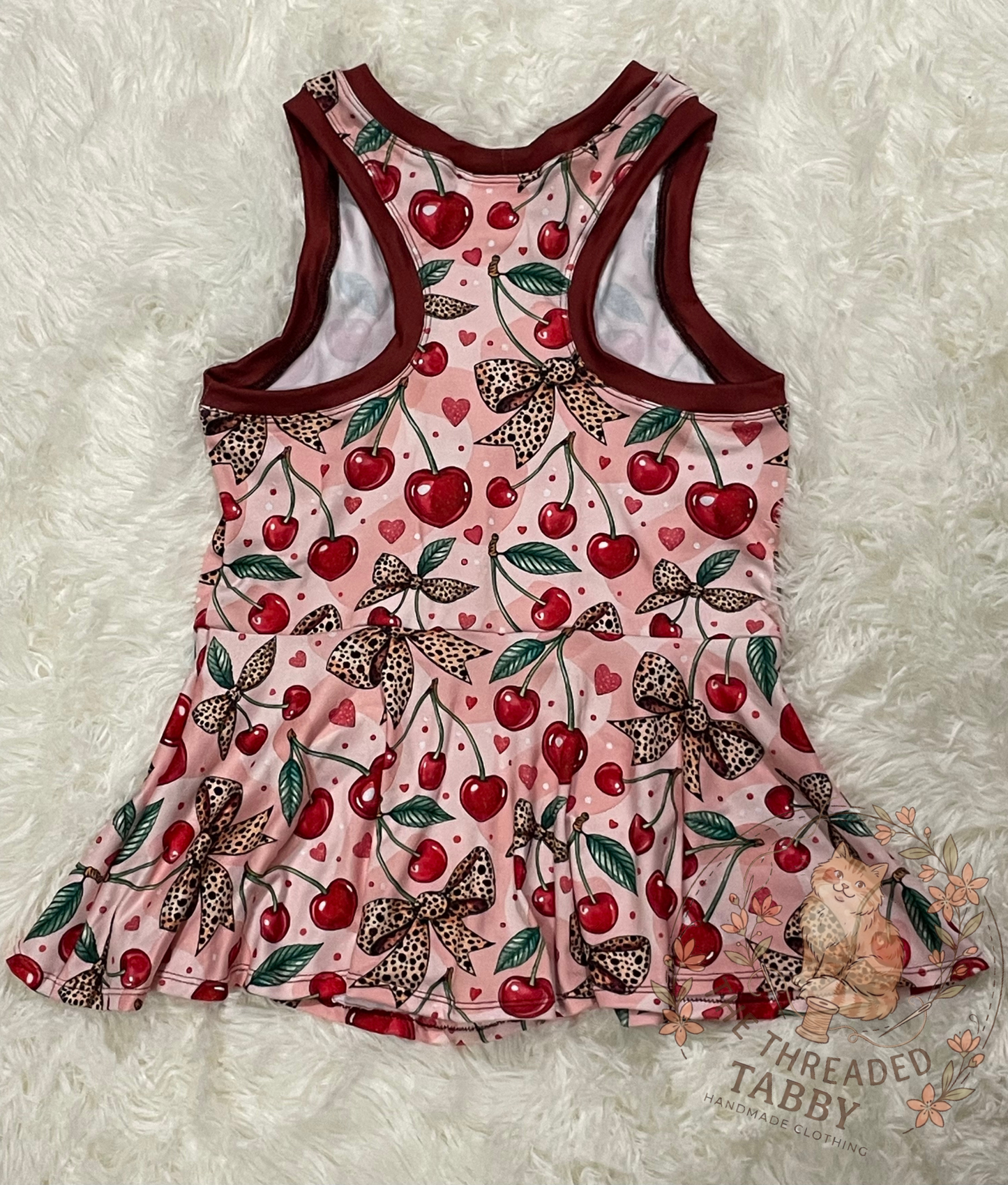 Kelsey Peplum | Cherry Leopard Bow